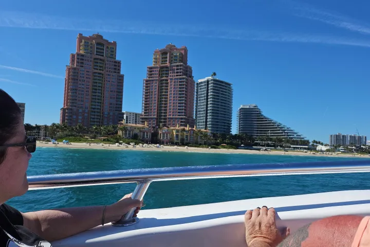 a body of water with a city in the background