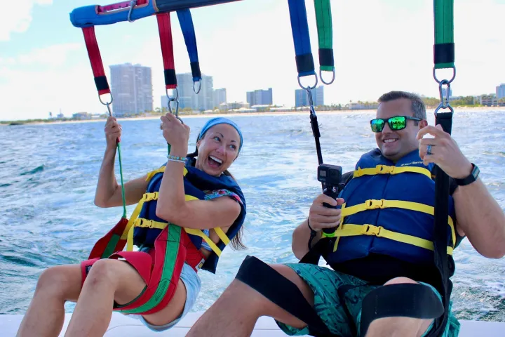 a group of people in a boat on a body of water