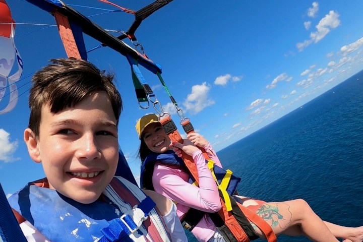 a group of people in a boat on a body of water