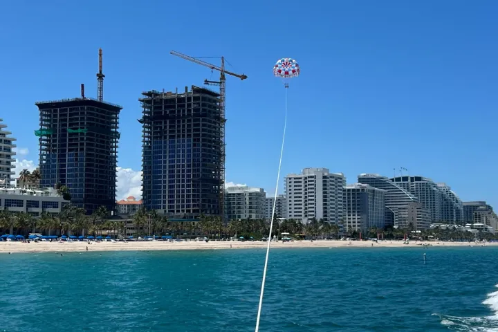 a body of water with a city in the background