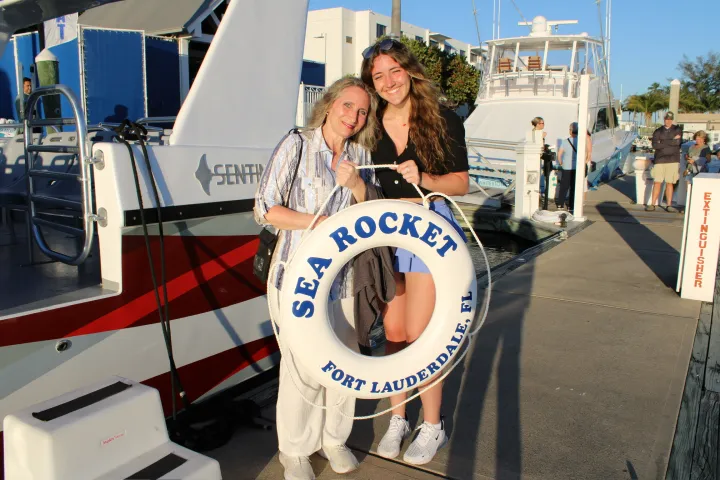a man and a woman standing in front of a truck