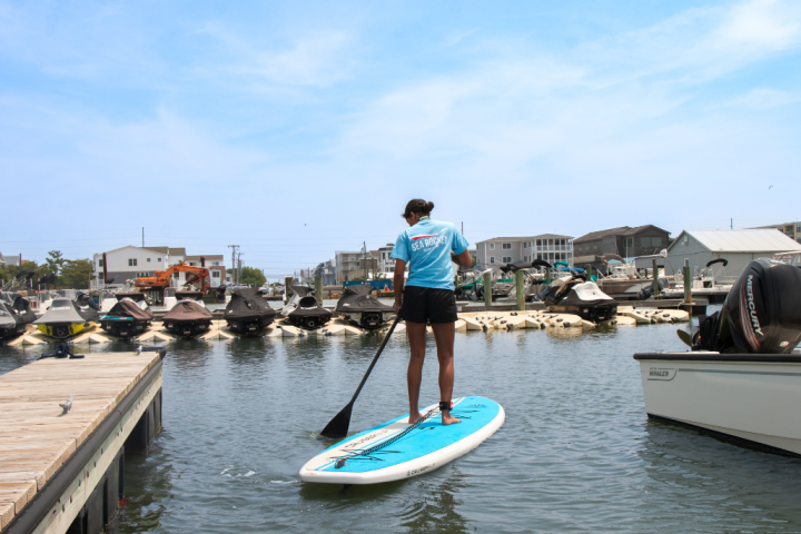 a girl paddleboarding