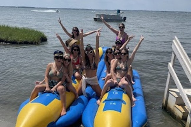 a group of people in a boat on a body of water