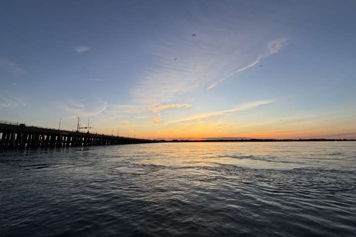 a sunset over a body of water