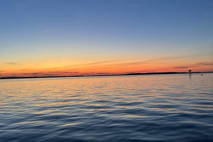 a sunset over a body of water