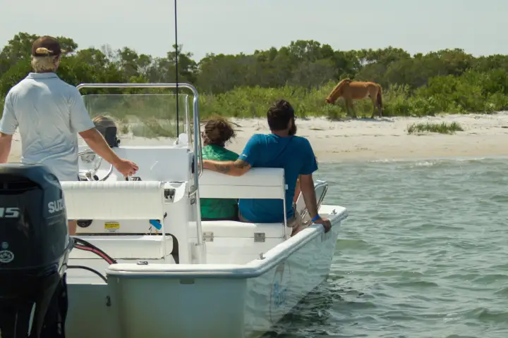 a group of people on a boat in the water
