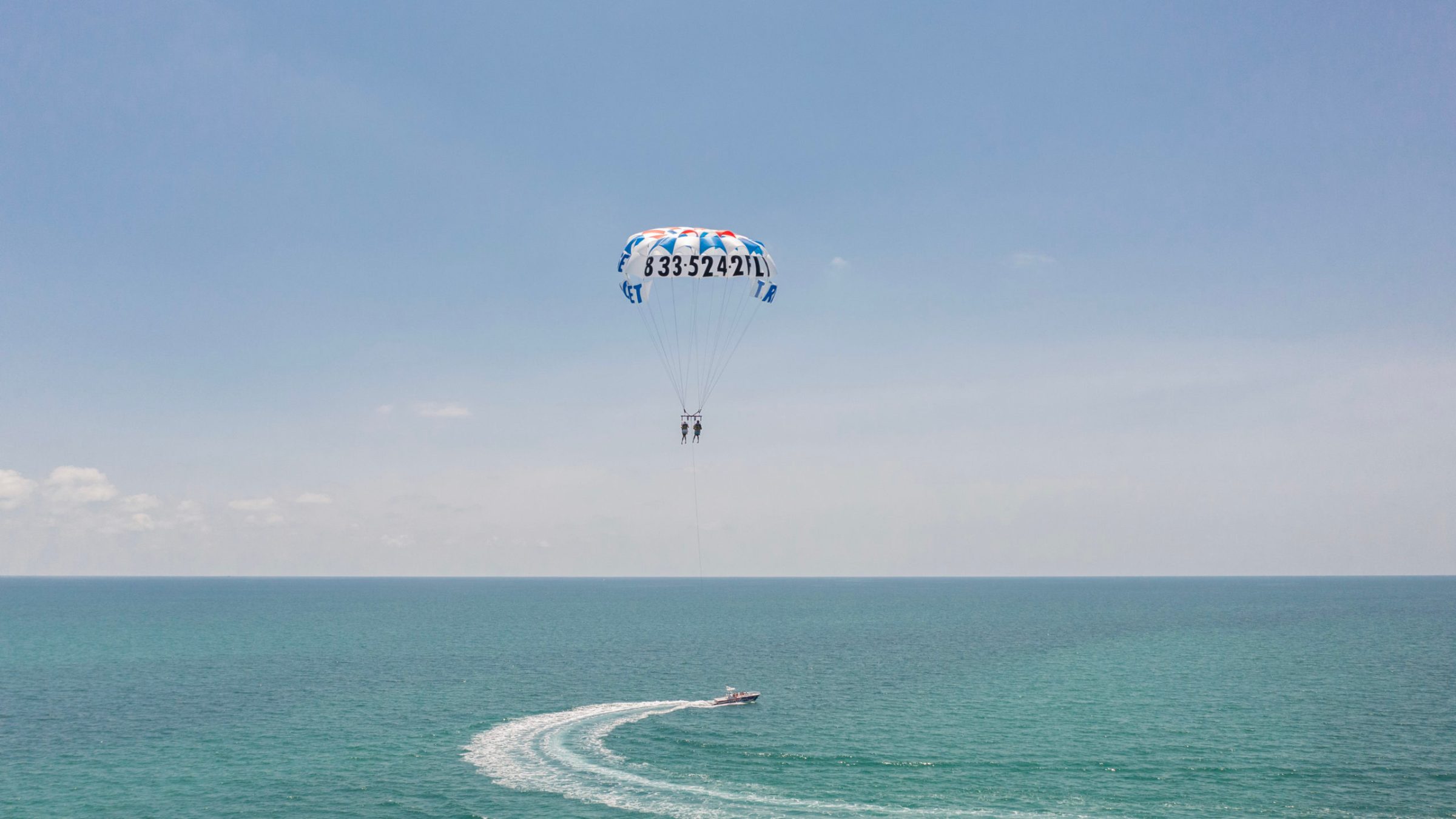 a parachute with a body of water