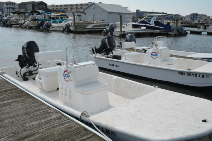 a boat is docked next to a body of water