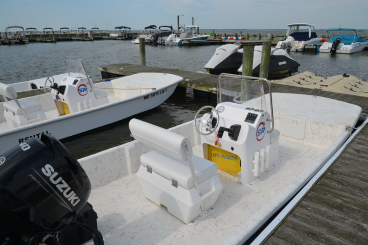 a boat sitting on top of a beach