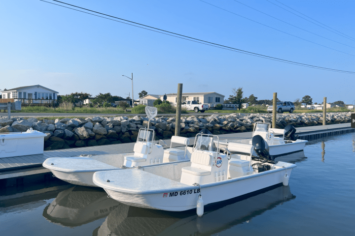 a boat is docked next to a body of water