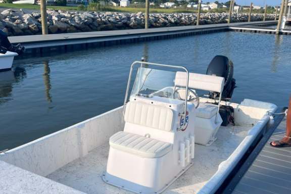 a boat is docked next to a body of water