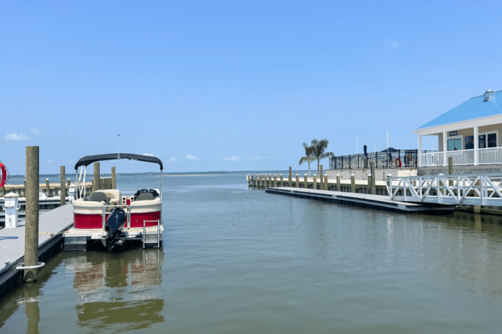 a boat is docked next to a body of water