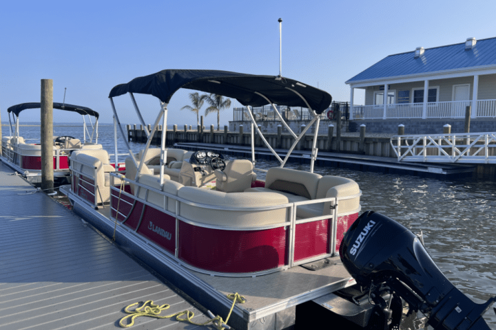 a boat is docked next to a body of water