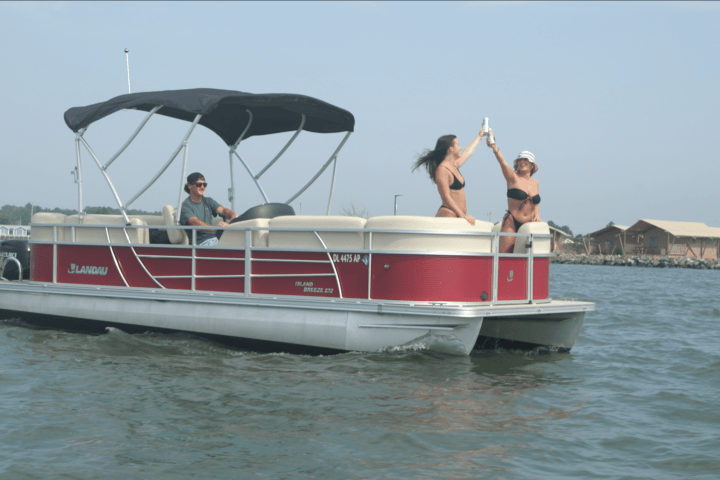 a group of people on a boat in the water