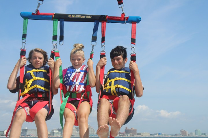a group of people riding on the back of a boat
