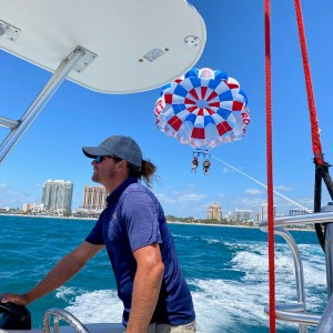 a man standing on a boat in the water