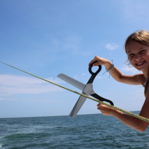 a person standing next to a body of water
