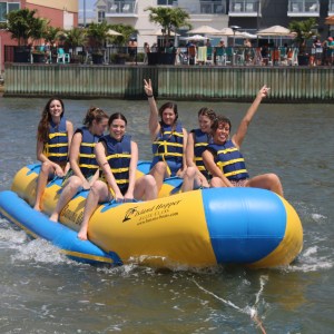 a group of people on a raft in a body of water