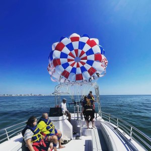a group of people on a boat in the water