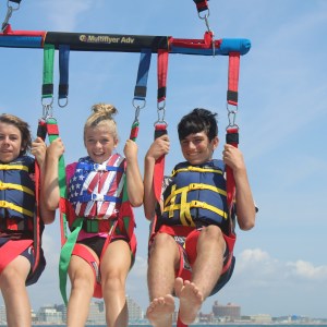 a group of people riding on the back of a boat