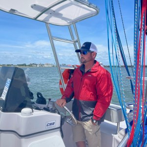 a man riding on the back of a boat