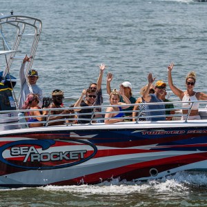 a group of people on a boat in the water