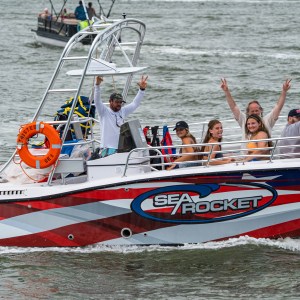 a group of people on a boat in the water