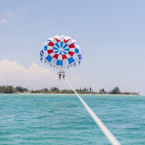 a parachute is sitting next to a body of water