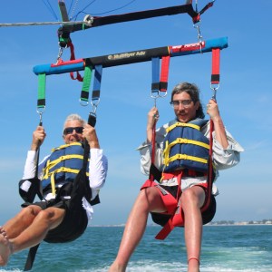 a person riding on the back of a boat in the water