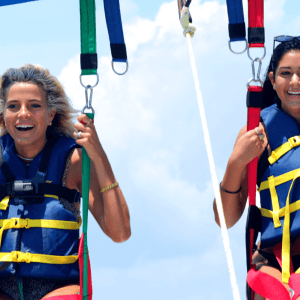 a man and a woman taking a selfie in a swing