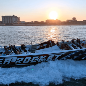 a boat that is sitting on a bench next to a body of water