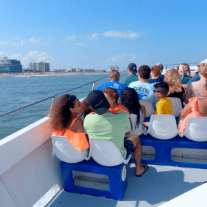 a group of people in a boat on a body of water
