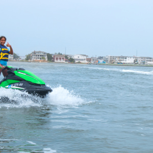 a person riding a surf board on a body of water