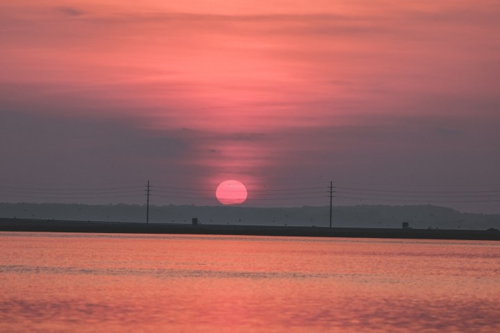 a sunset over a body of water