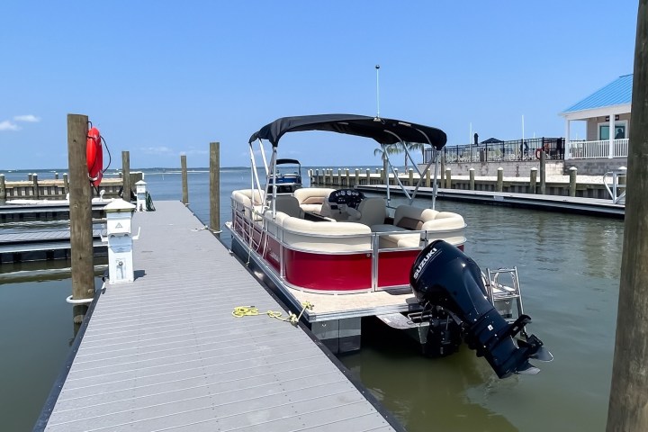 a boat is docked next to a body of water