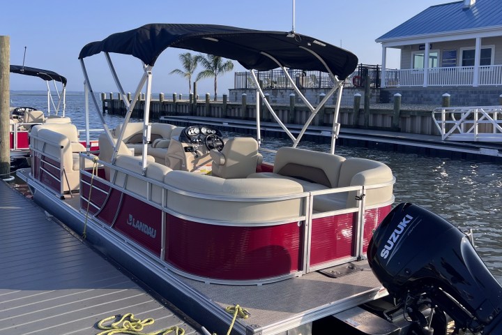 a boat is docked next to a body of water