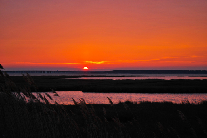 a sunset over a body of water