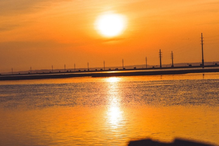 a sunset over a body of water