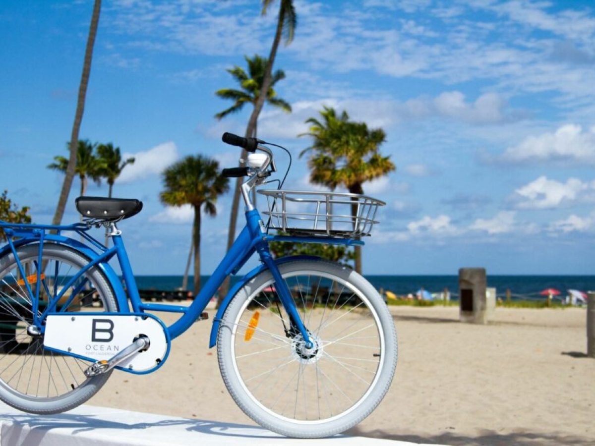 a bicycle parked on a beach