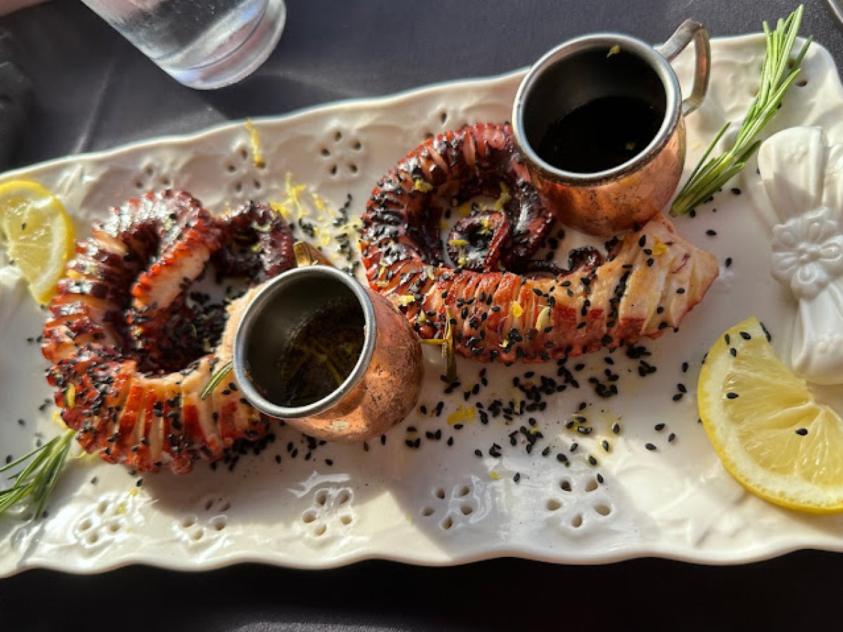 a plate of food and a cup of coffee