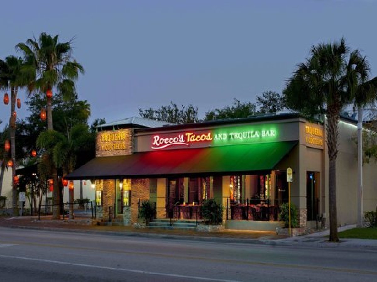 a sign on an awning on the side of a road
