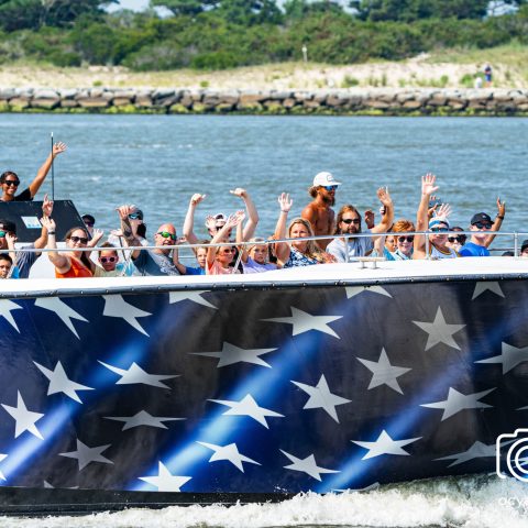 a group of people in a boat on a body of water