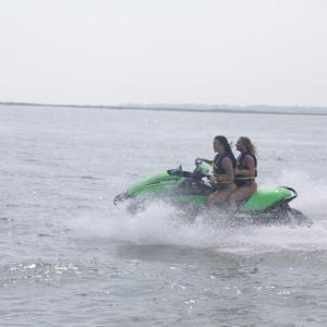 a man riding a wave on a surf board on a body of water