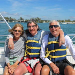 a couple of people that are sitting on a boat in the water