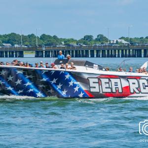 a group of people on a boat in a large body of water