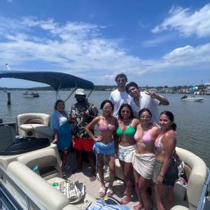 a group of people on a boat in the water