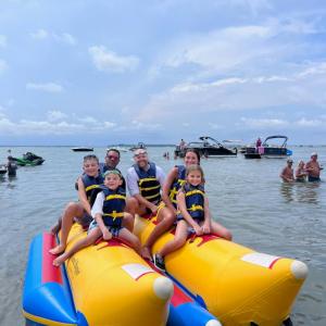a group of people on a raft in a body of water