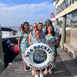 a group of people holding a sign