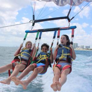 a person riding on the back of a boat in the water