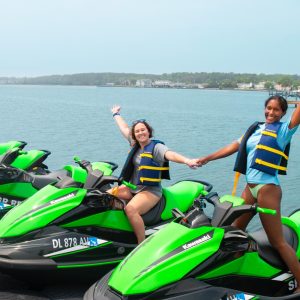 Sierra Scott riding a motorcycle next to a body of water